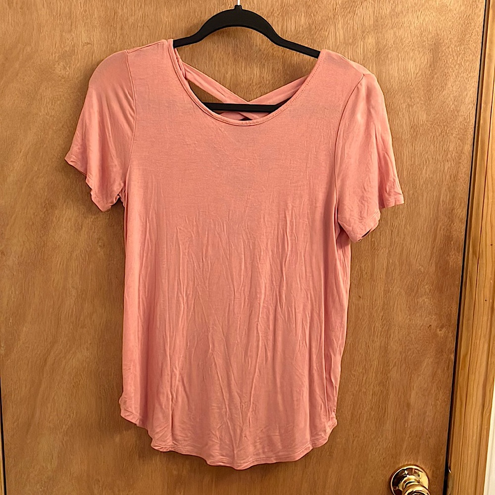 Ambiance pink tee shirt with criss cross details in the back woman’s size small